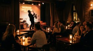 A moody, upscale jazz club interior in Warsaw with dim amber lighting, a silhouette of a musician pl
